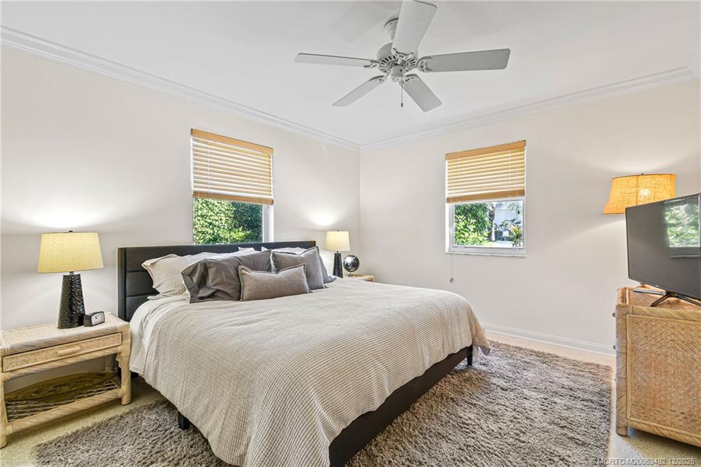 229 Colony Road Jupiter, FL 33469 - Photo 21 of 52 a bedroom with beds and a tv