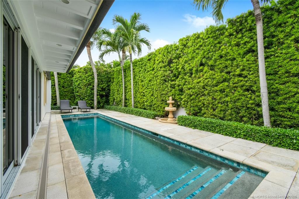 229 Colony Road Jupiter, FL 33469 - Photo 31 of 52 a balcony with tall trees