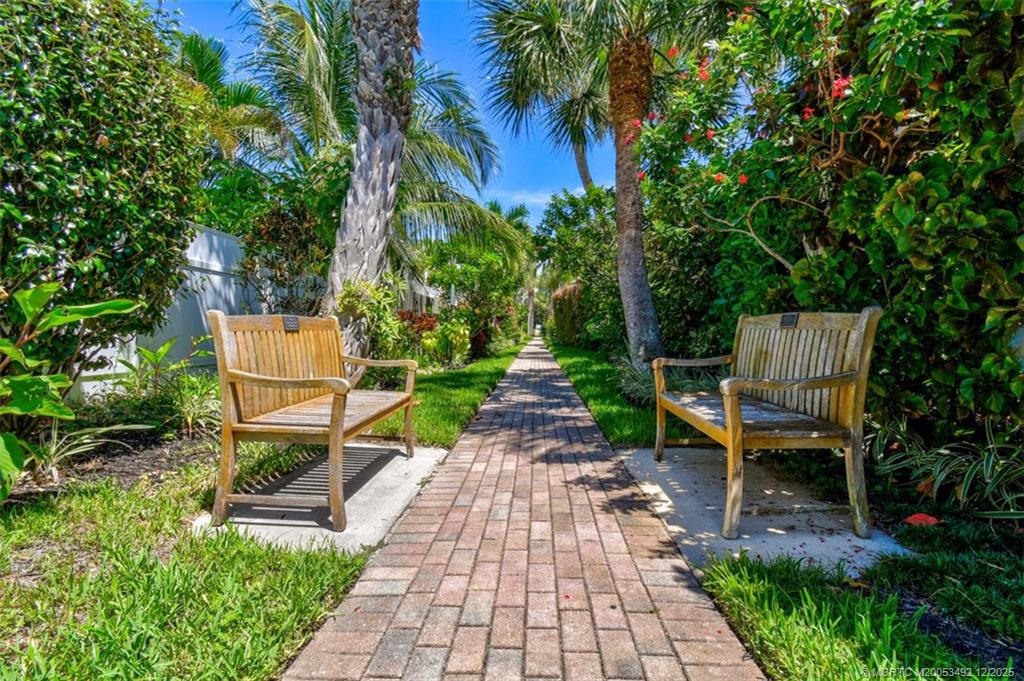 229 Colony Road Jupiter, FL 33469 - Photo 41 of 52 a view of a table and chairs in the garden