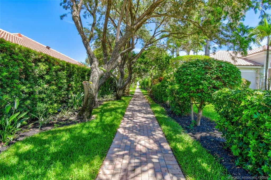 229 Colony Road Jupiter, FL 33469 - Photo 42 of 52 a view of a pathway both side of yard