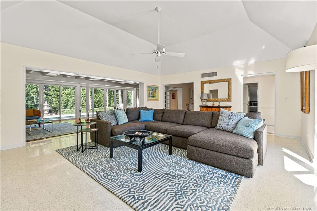 229 Colony Road Jupiter, FL 33469 - Photo 5 of 52 a living room with furniture and a floor to ceiling window