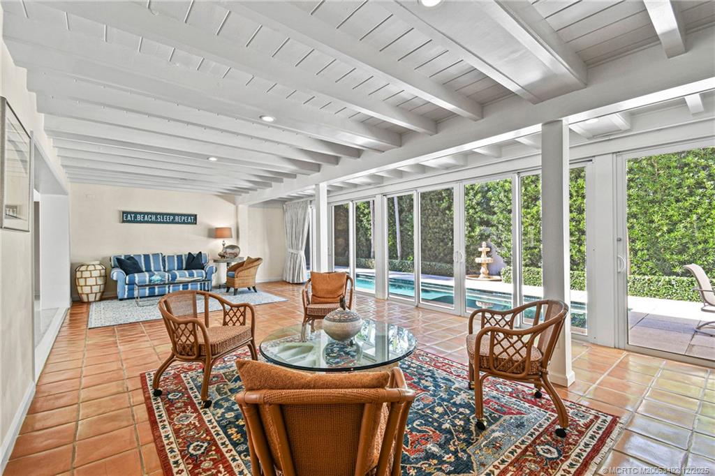 229 Colony Road Jupiter, FL 33469 - Photo 7 of 52 a living room with patio furniture and a large window