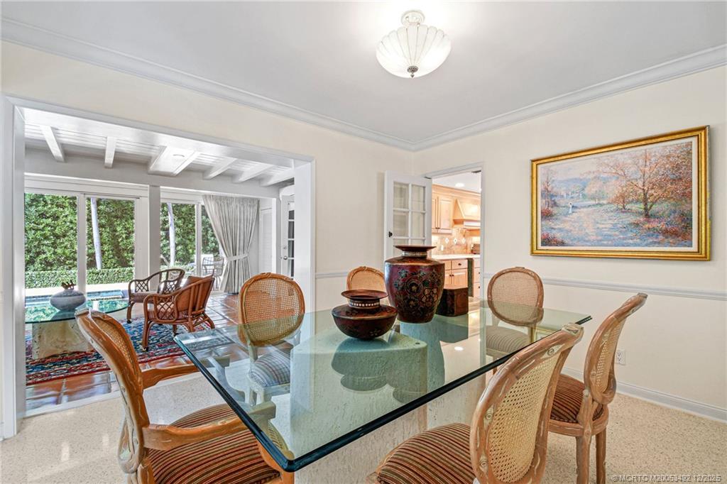 229 Colony Road Jupiter, FL 33469 - Photo 9 of 52 a dining room with furniture and wooden floor