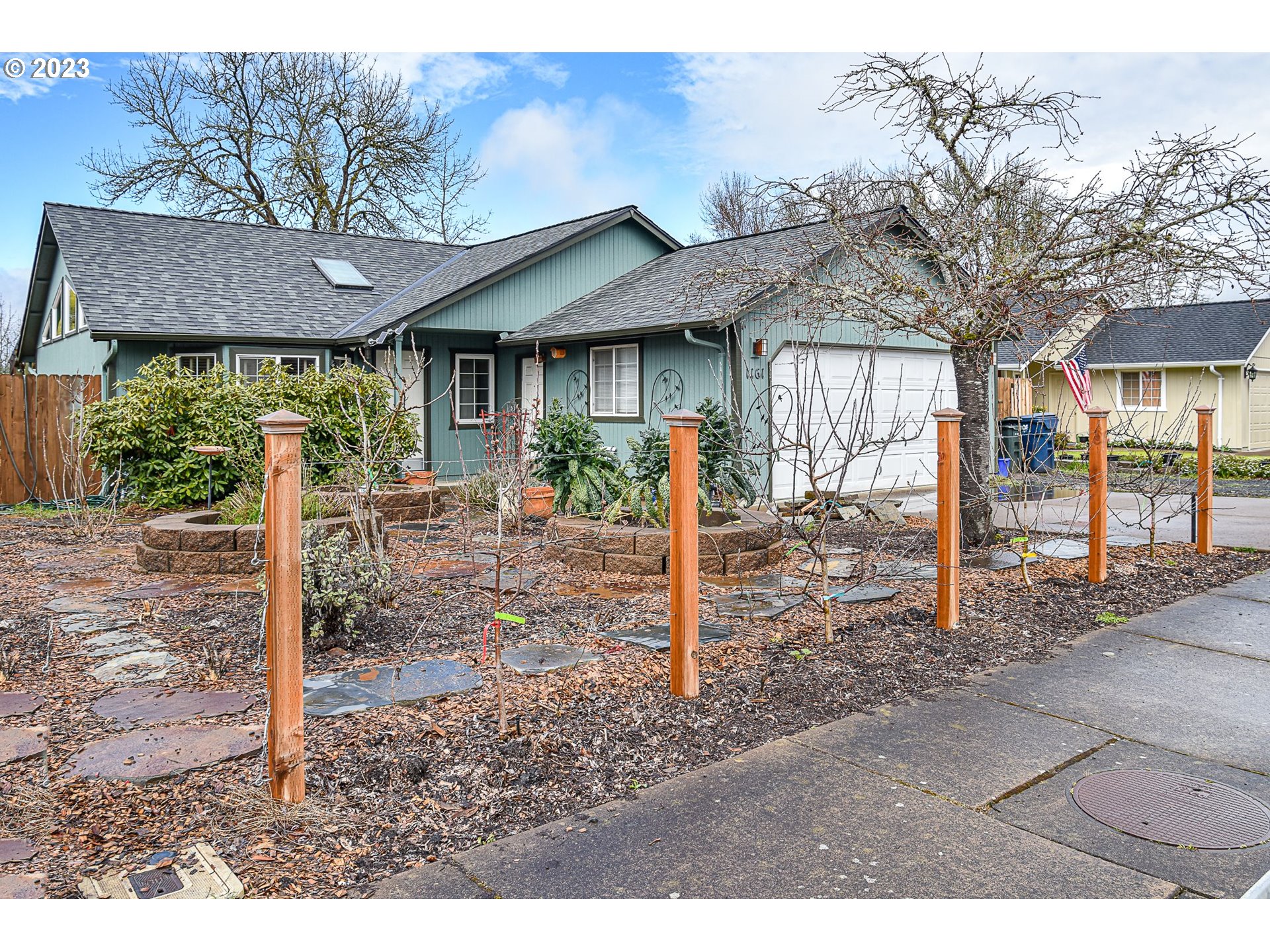 a backyard of a house with barbeque oven