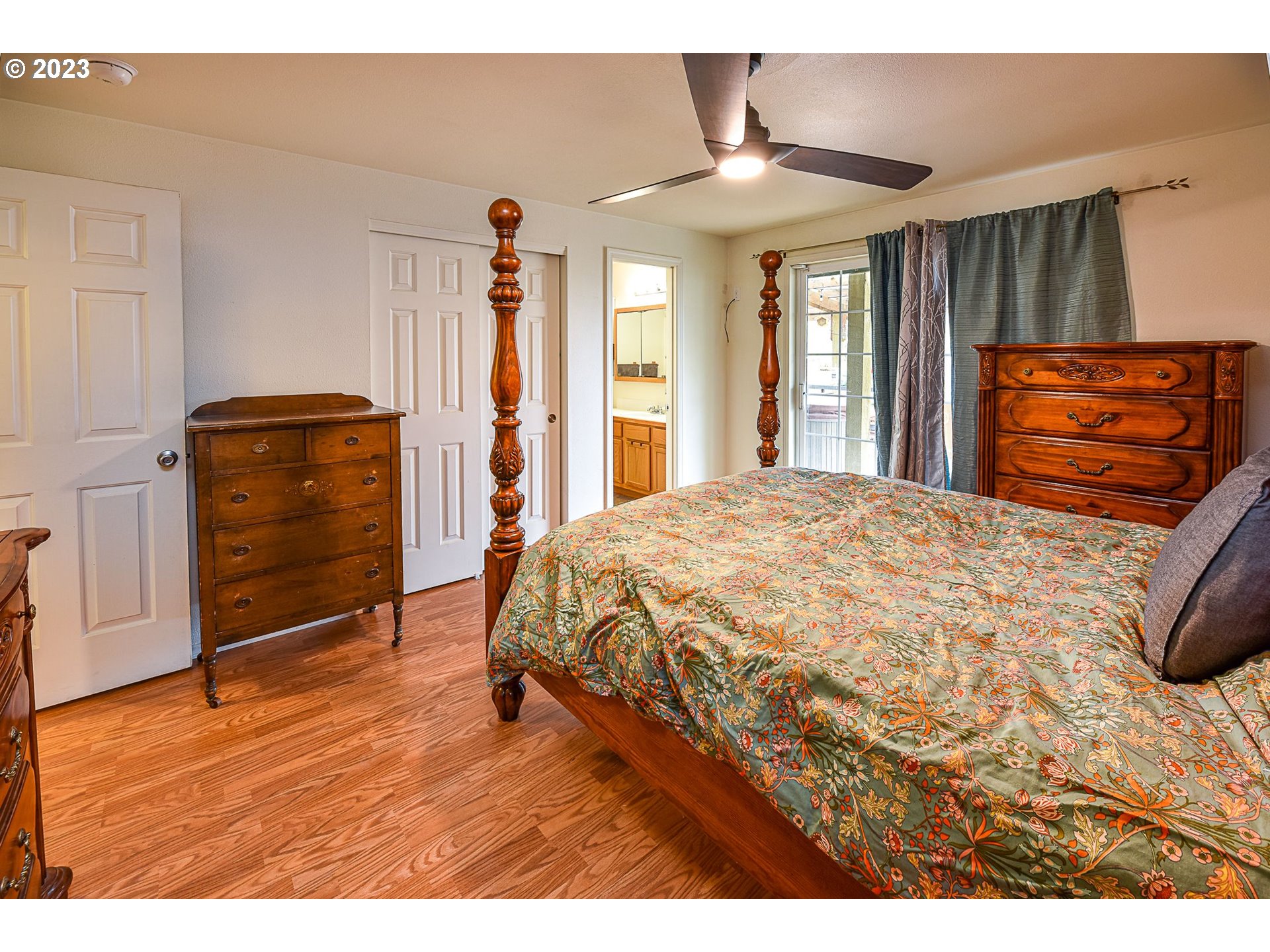 1161 Ash Grove Loop Creswell, OR 97426 - Photo 12 of 22 a bedroom with a bed and a dresser
