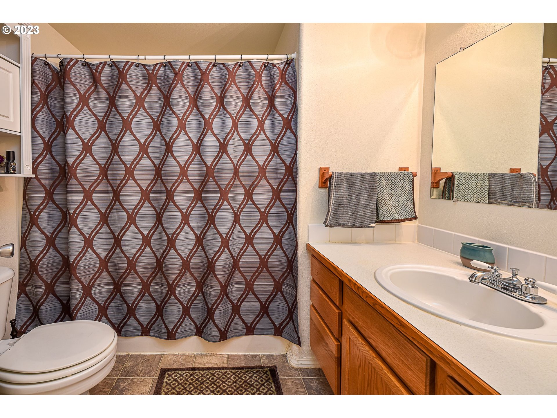 1161 Ash Grove Loop Creswell, OR 97426 - Photo 15 of 22 a bathroom with a sink and a mirror