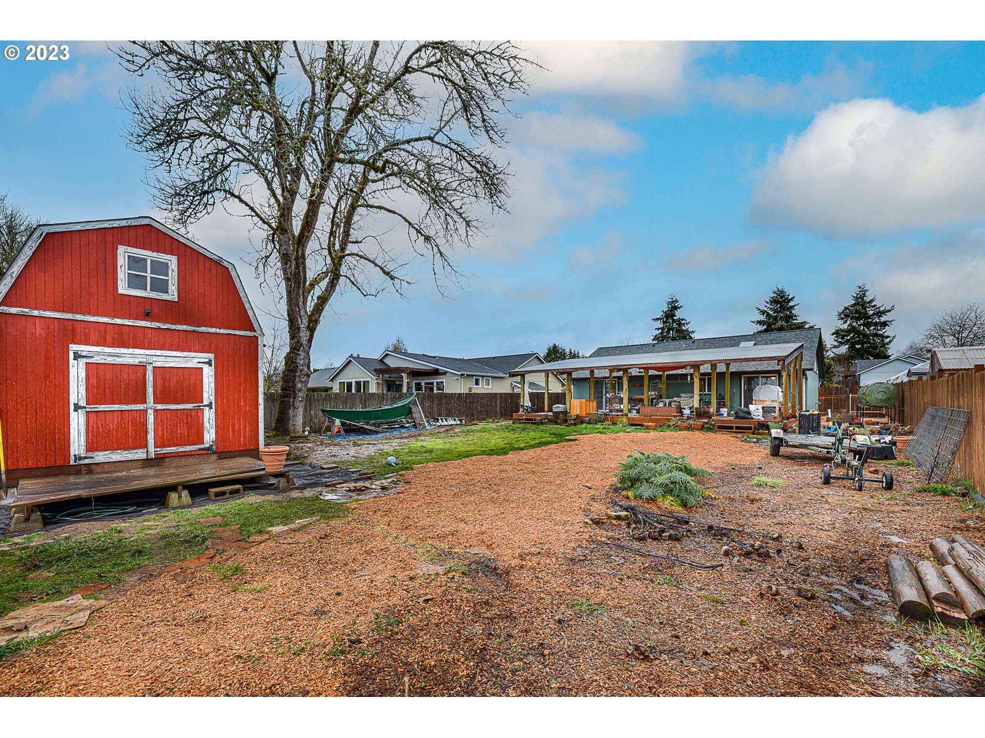 1161 Ash Grove Loop Creswell, OR 97426 - Photo 17 of 22 a view of a house with backyard and sitting area