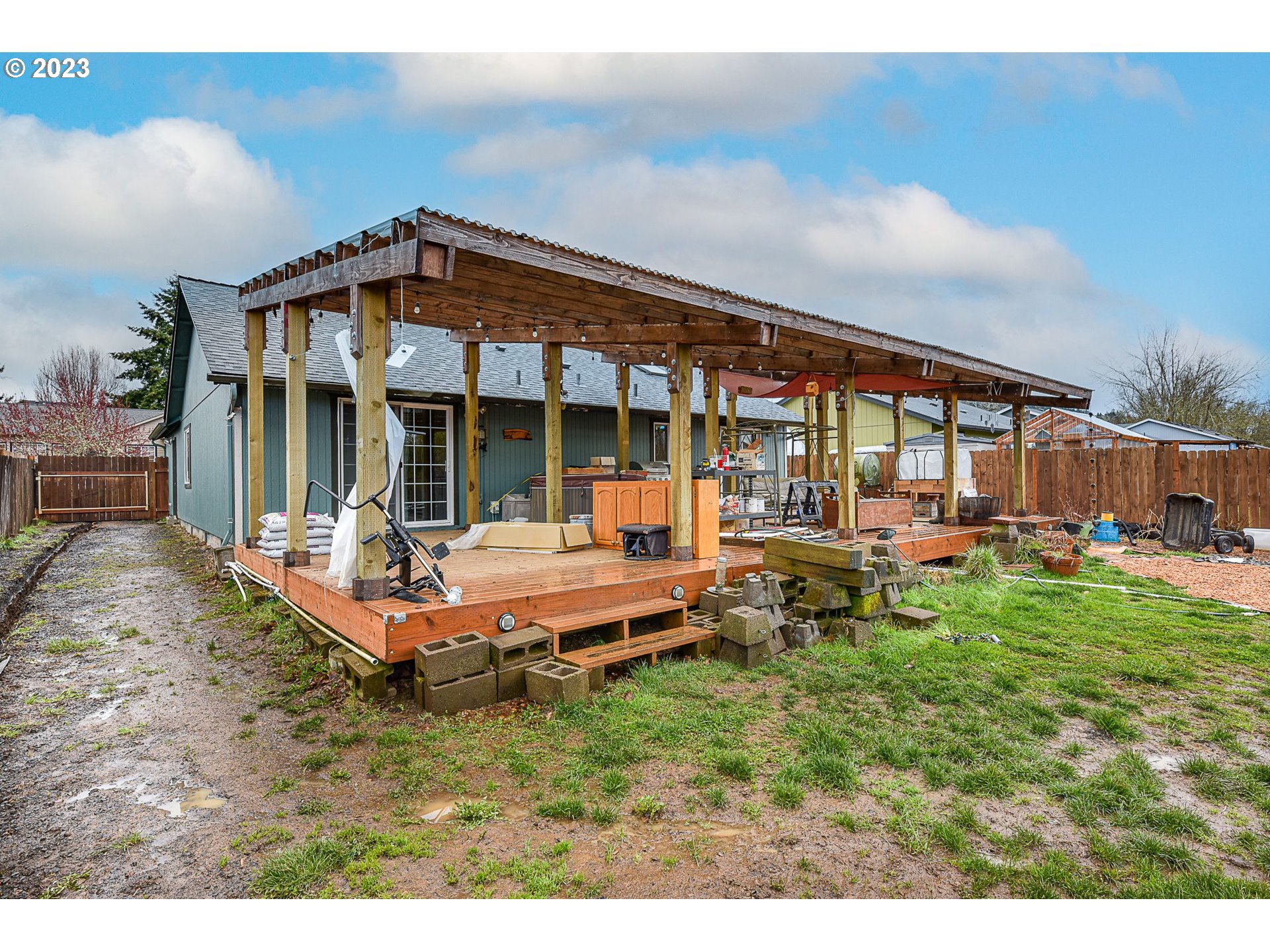 1161 Ash Grove Loop Creswell, OR 97426 - Photo 21 of 22 a backyard of a house with table and chairs
