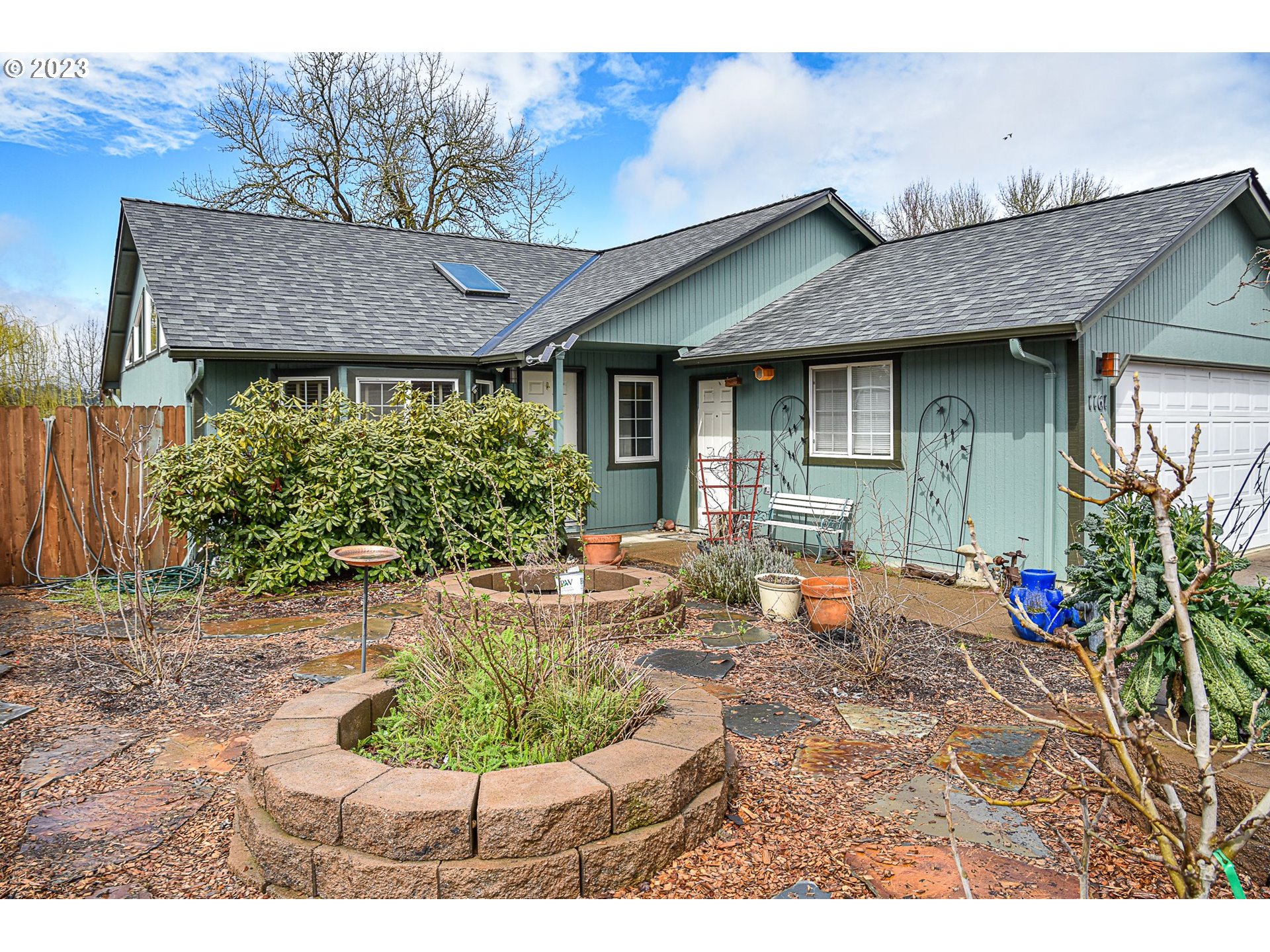 1161 Ash Grove Loop Creswell, OR 97426 - Photo 22 of 22 a backyard of a house with seating space