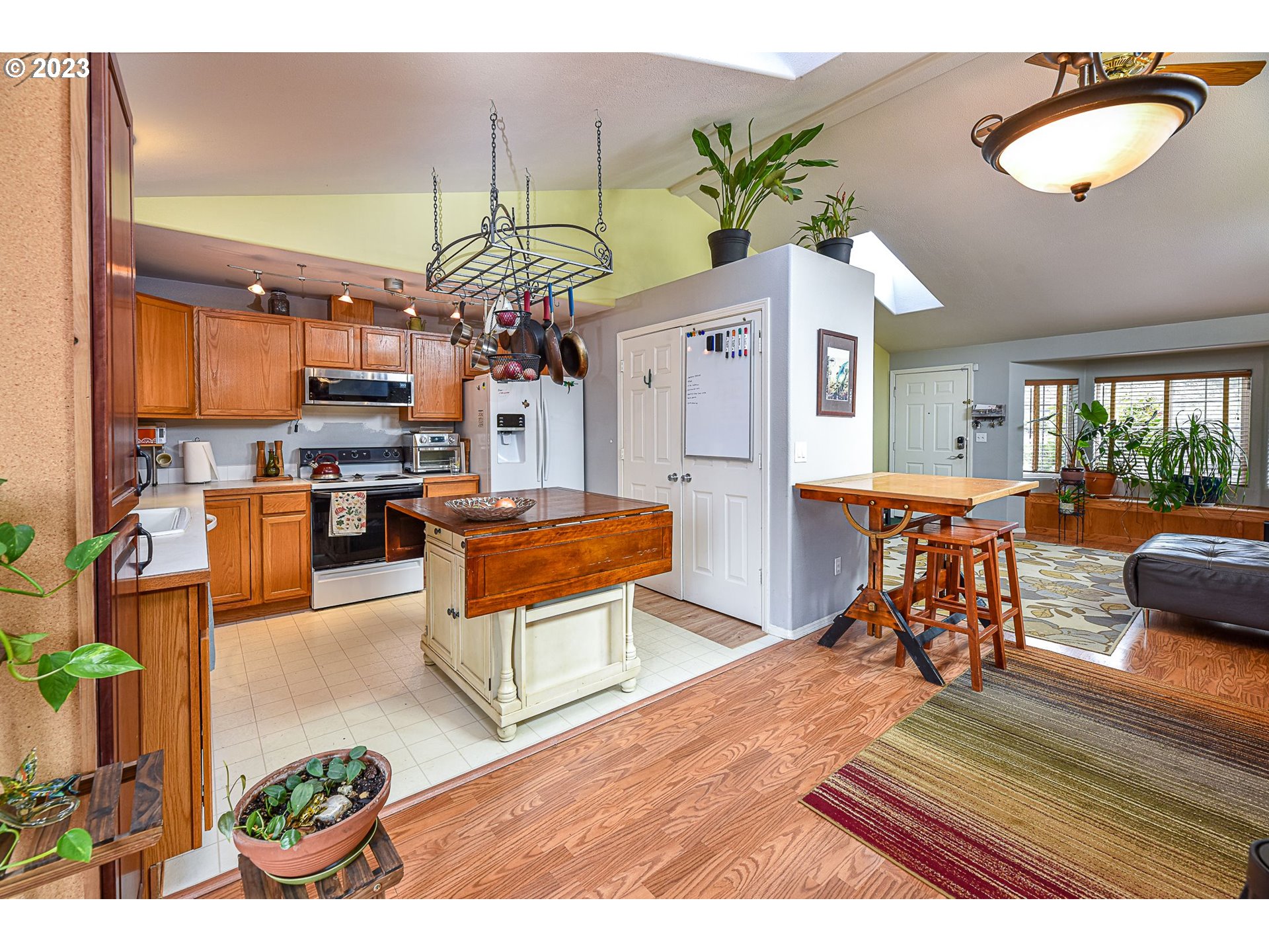 1161 Ash Grove Loop Creswell, OR 97426 - Photo 4 of 22 a living room with furniture and a chandelier