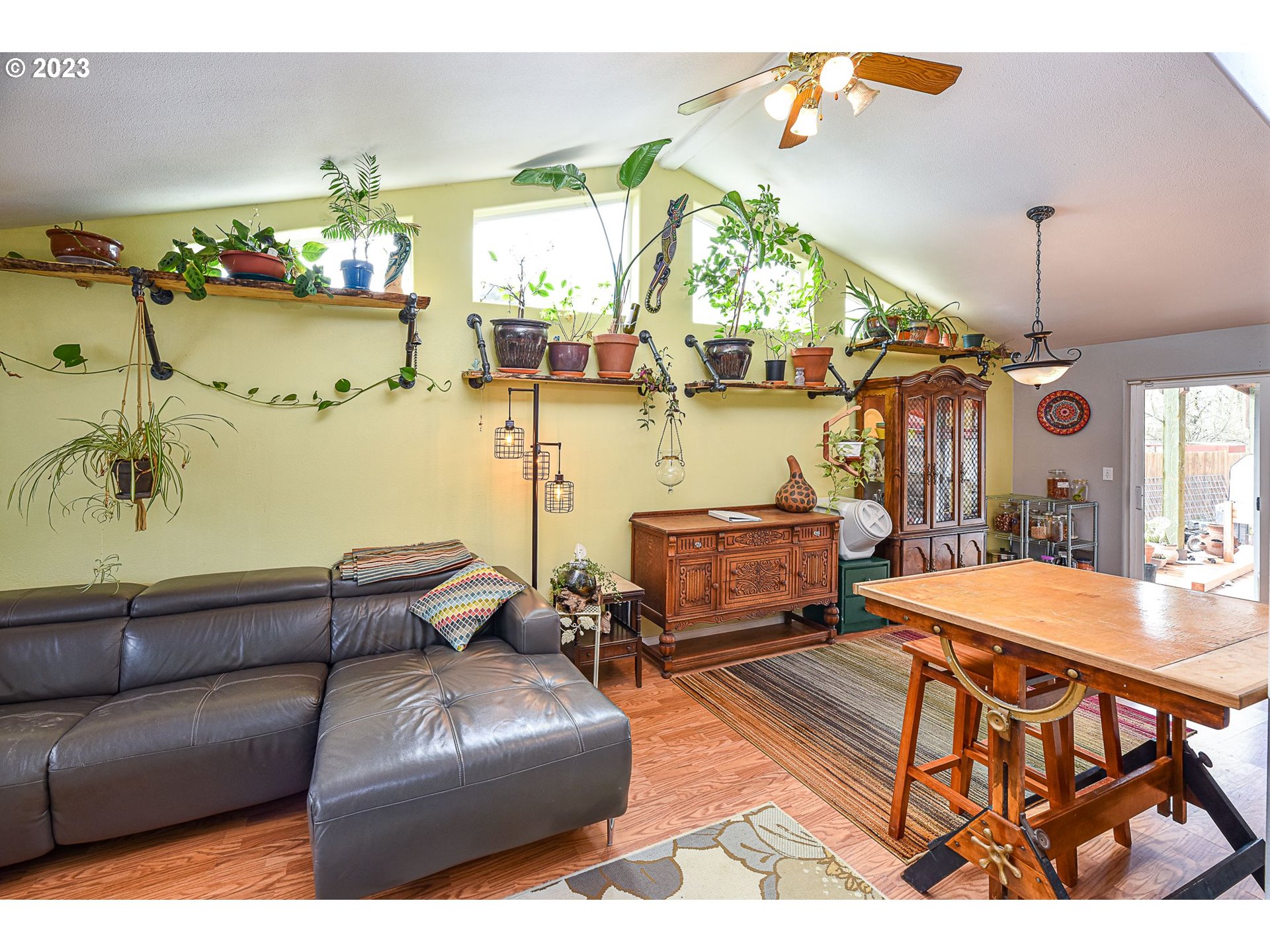 1161 Ash Grove Loop Creswell, OR 97426 - Photo 6 of 22 a living room with furniture and a chandelier