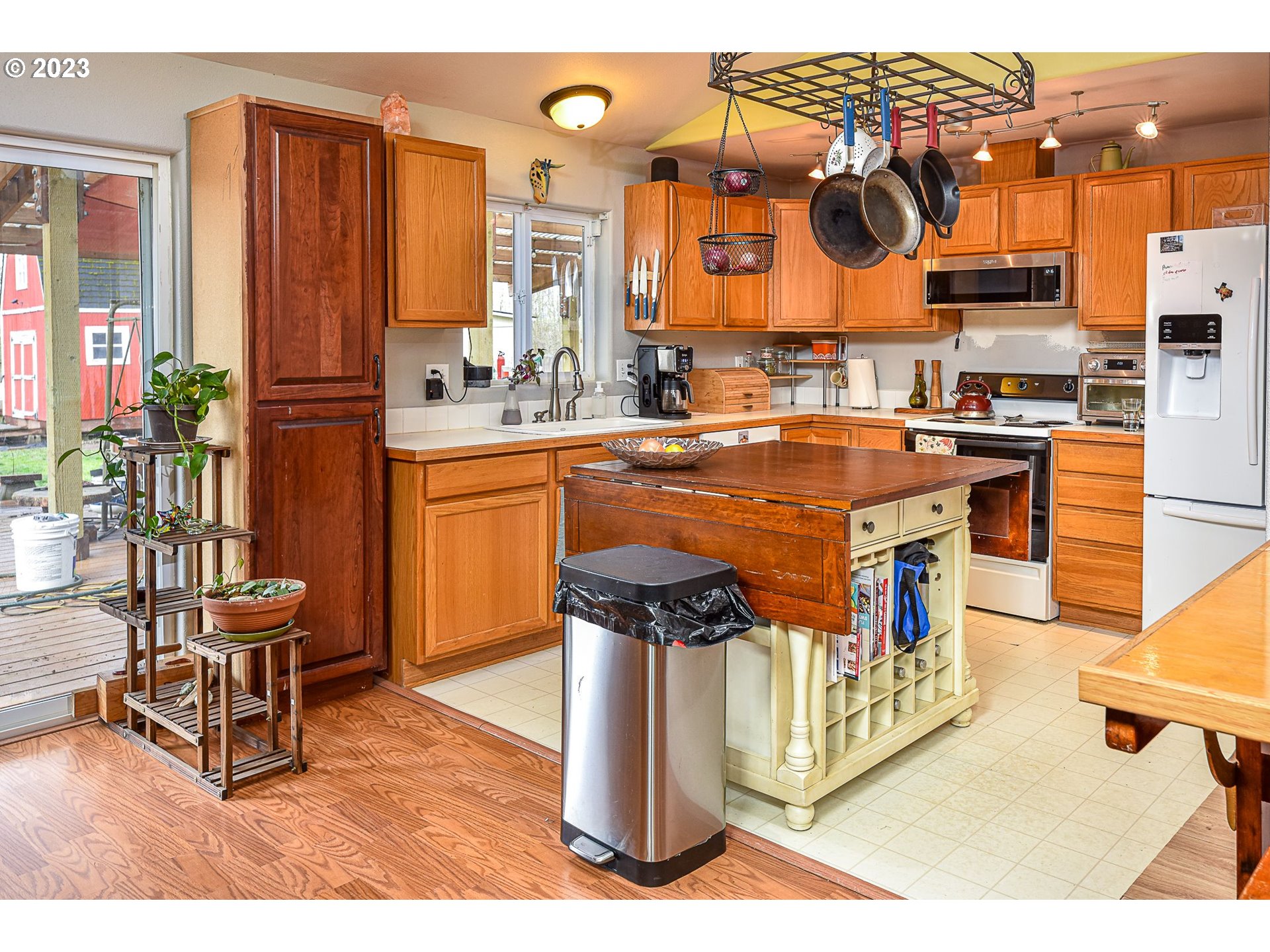 1161 Ash Grove Loop Creswell, OR 97426 - Photo 8 of 22 a kitchen with stainless steel appliances granite countertop a stove top oven and a dining table