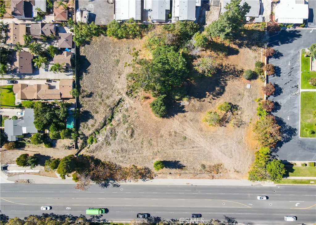an aerial view of a houses with yard