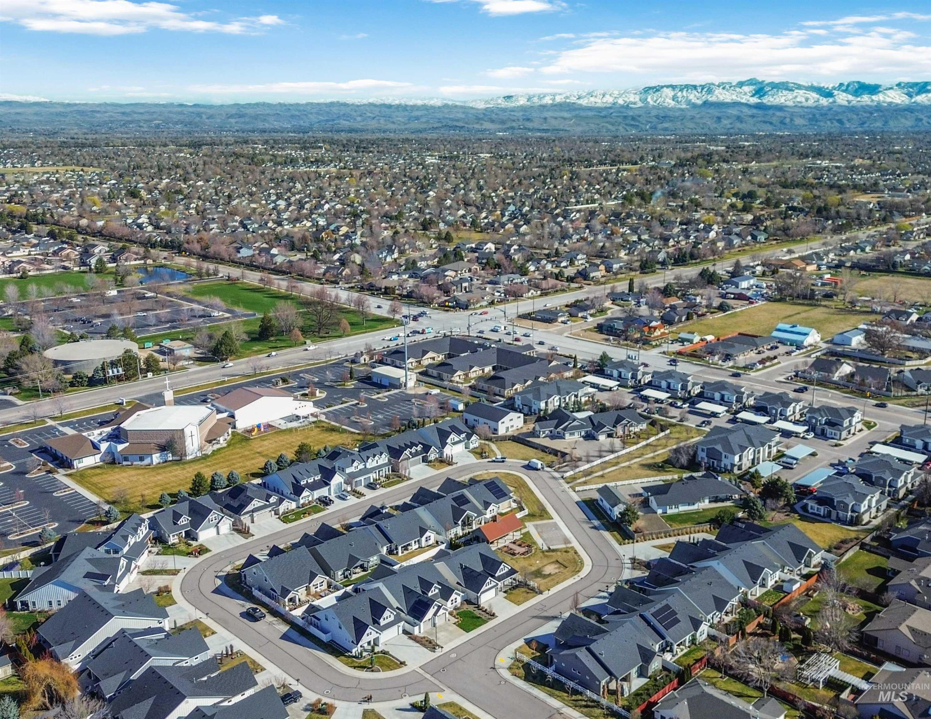 2985 North Meridian Road Meridian, ID 83646 - Photo 8 of 9 Aerial perspective of suburban area featuring a mountain backdrop