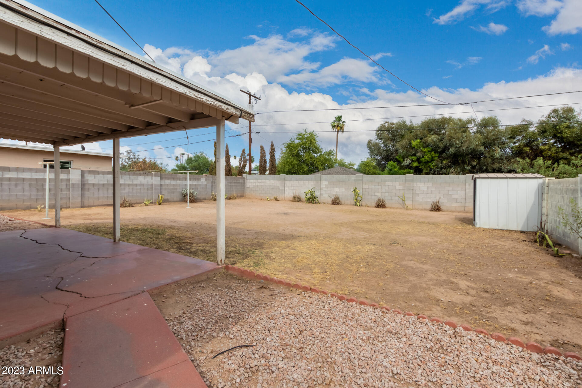 3015 North 17th Avenue Phoenix, AZ 85015 - Photo 24 of 27 a backyard of a house with table and chairs