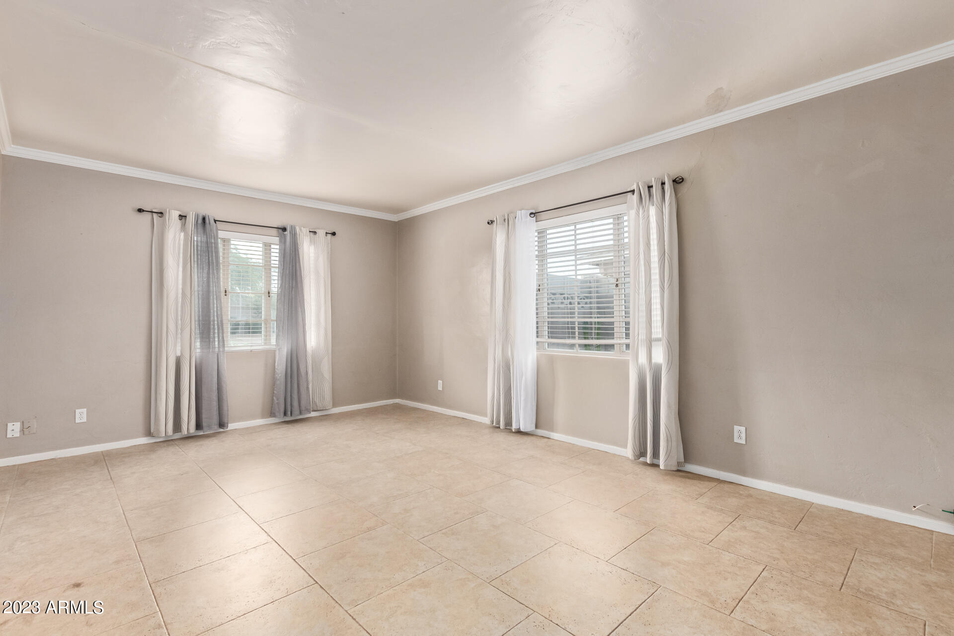 3015 North 17th Avenue Phoenix, AZ 85015 - Photo 7 of 27 a view of an empty room with a window