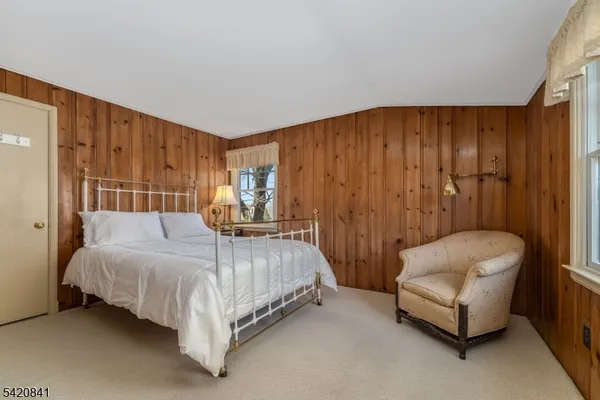 a bed room with a bed and a couch