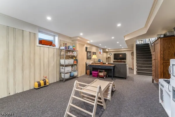 a view of a livingroom with furniture and toys