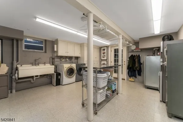 a utility room with closet dryer and washer