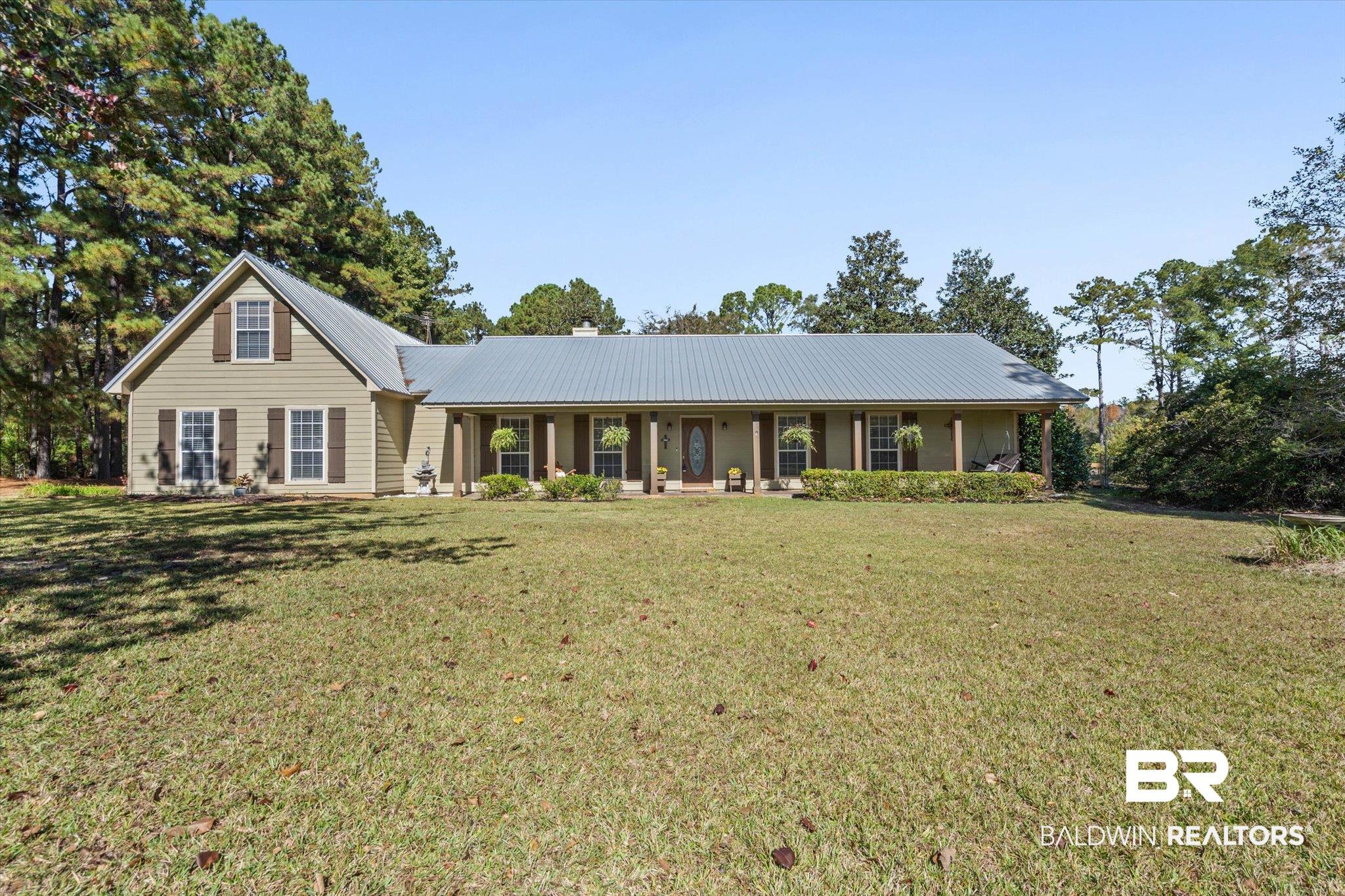 180 Creax Road Axis, AL 36505 - Photo 32 of 35 Single story home with a metal roof, a porch, and a front yard