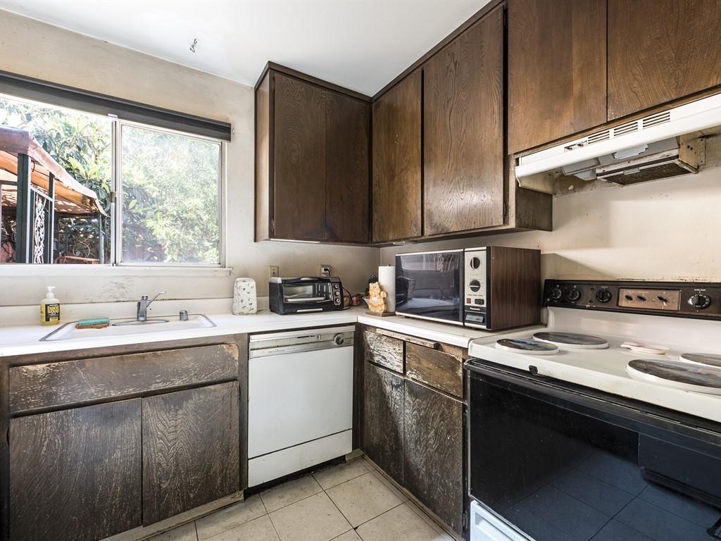149 El Dorado Common Fremont, CA 94539 - Photo 7 of 12 a kitchen with a sink stove and cabinets
