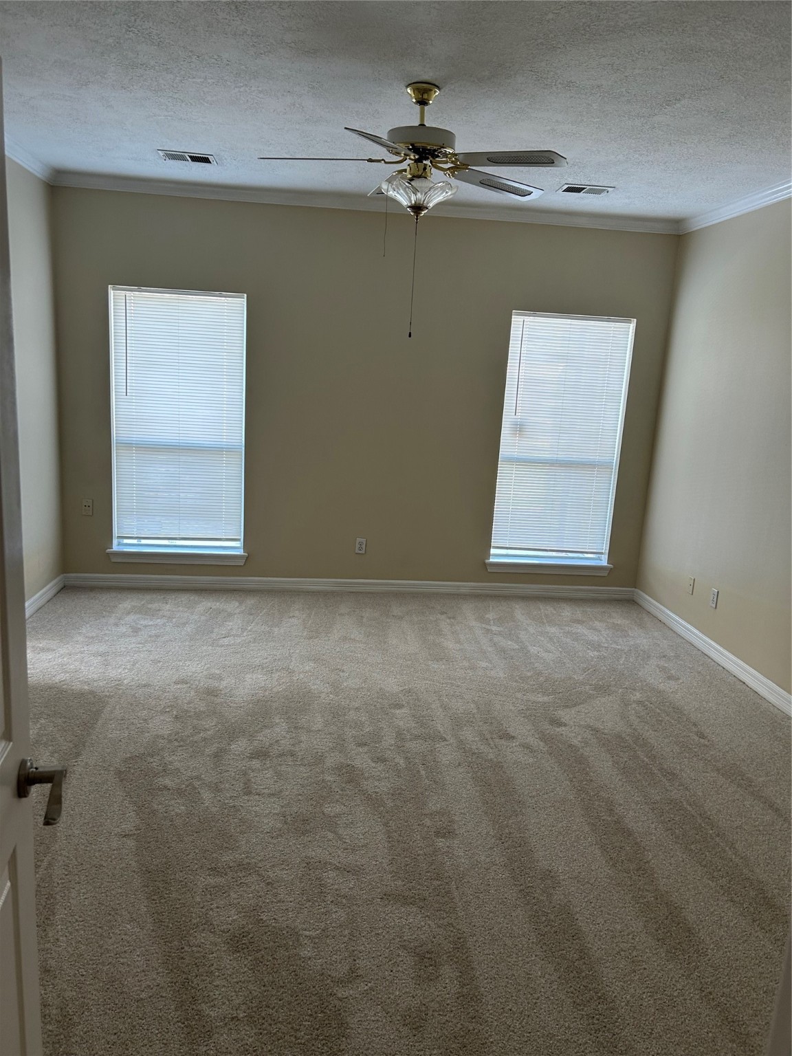 17610 West Fawn River Circle Spring, TX 77379 - Photo 9 of 15 an empty room with a ceiling fan and a window