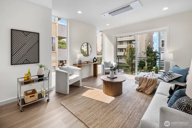 a living room with furniture and a window