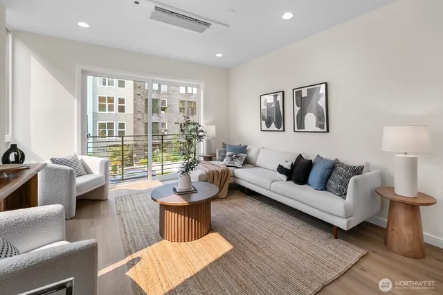 a living room with furniture and a large window