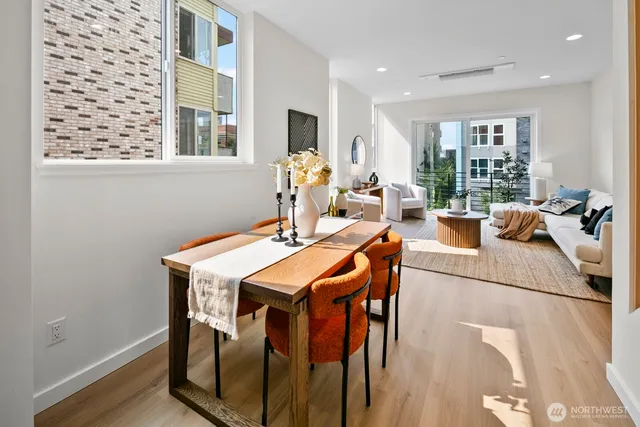 a view of a dining room with furniture and window