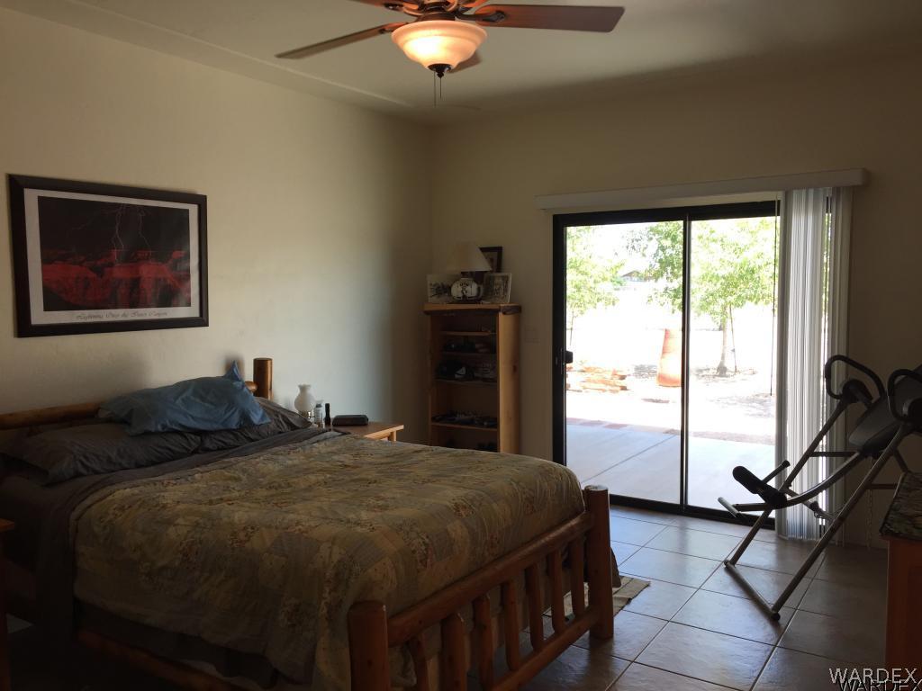 3133 West Carmichael Road Golden Valley, AZ 86413 - Photo 23 of 35 Master Bedroom Patio Access