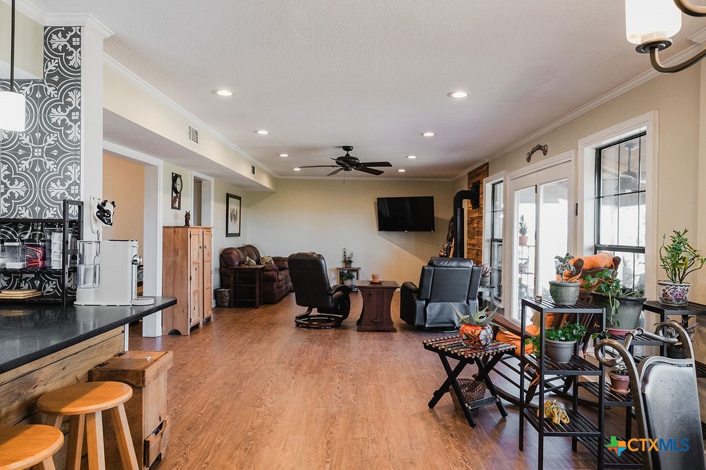 1439 Dagg Road Yoakum, TX 77995 - Photo 6 of 48 a living room with furniture a flat screen tv and a large window