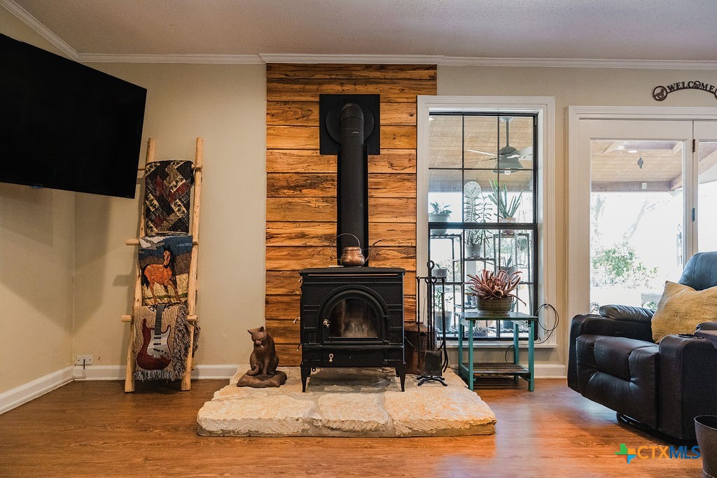 1439 Dagg Road Yoakum, TX 77995 - Photo 9 of 48 a living room with furniture a fireplace and a floor to ceiling window