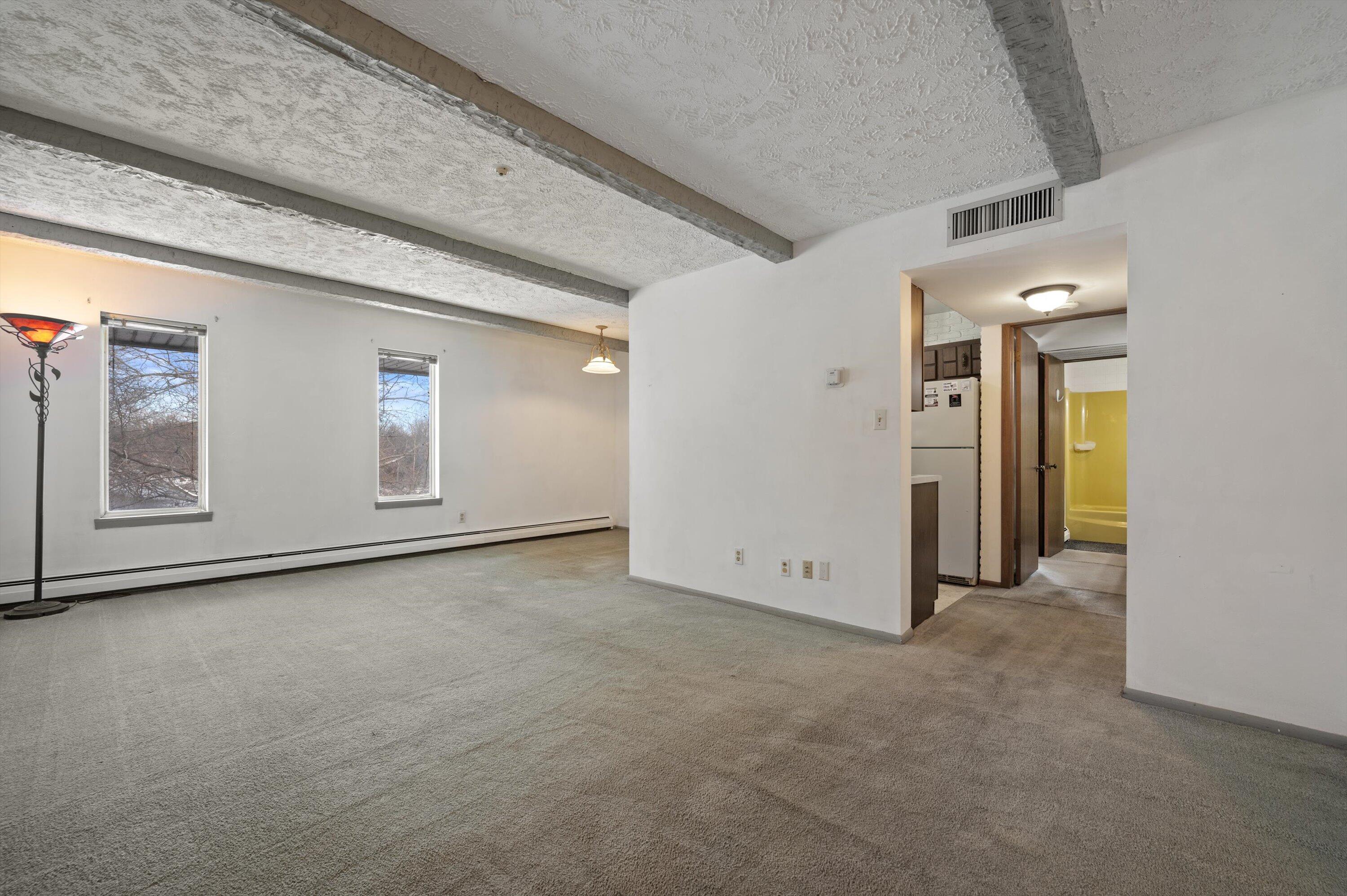 4000 West Rivers Edge Circle, Unit 24 Brown Deer, WI 53209 - Photo 2 of 17 Living Room with great views!