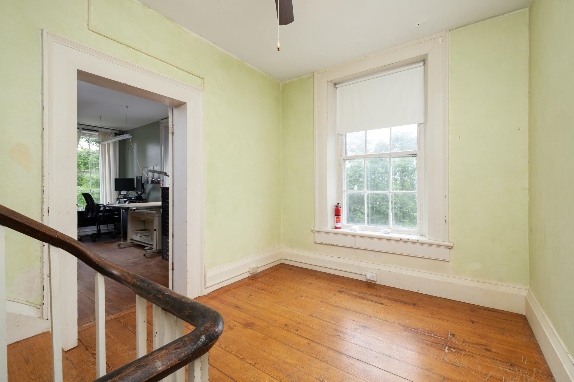 3 Rife's Ford Road Verona, VA 24482 - Photo 27 of 74 a view of a hallway to a livingroom with wooden floor and furniture