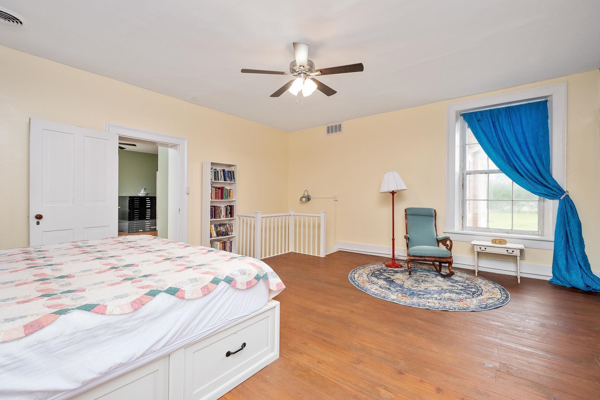 3 Rife's Ford Road Verona, VA 24482 - Photo 37 of 74 a bedroom with a large bed and a chandelier
