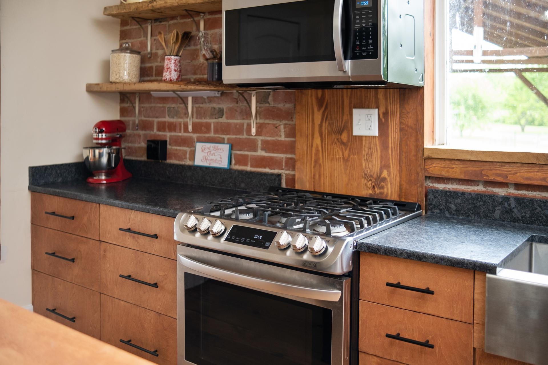 3 Rife's Ford Road Verona, VA 24482 - Photo 44 of 74 a kitchen with granite countertop stainless steel appliances stove top oven and cabinets