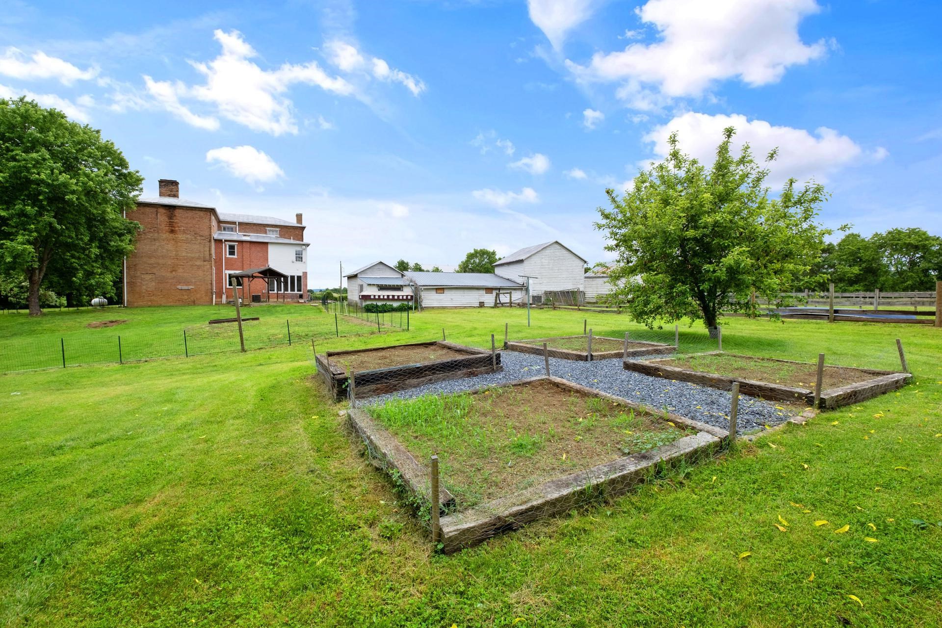 3 Rife's Ford Road Verona, VA 24482 - Photo 55 of 74 a view of a backyard with a garden and entertaining space