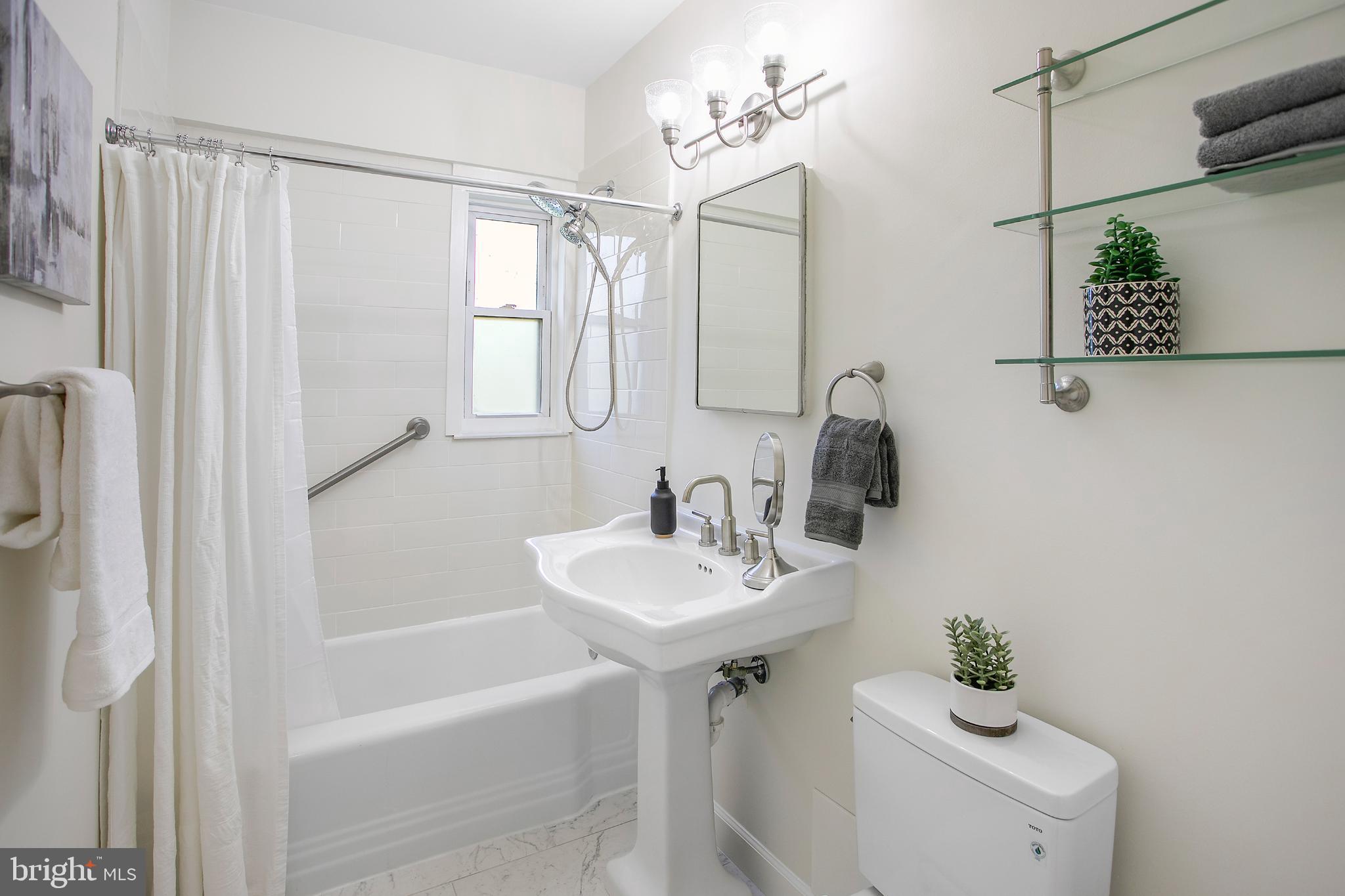 2500 Q Street Northwest, Unit 411 Washington, DC 20007 - Photo 11 of 24 Renovated Bathroom