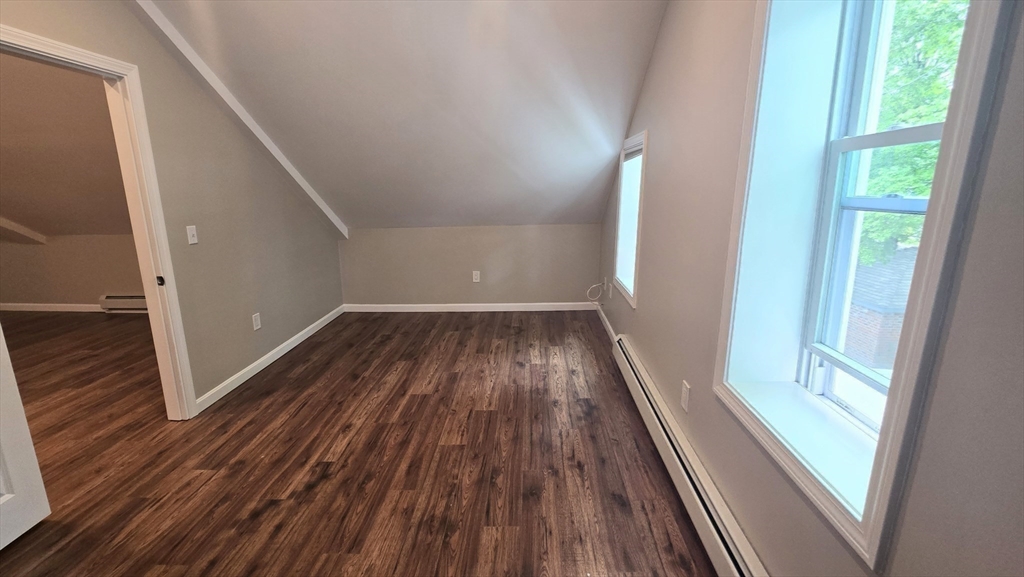 15 Central Street, Unit 4 Georgetown, MA 01833 - Photo 13 of 24 a view of a hallway view with wooden floor and staircase