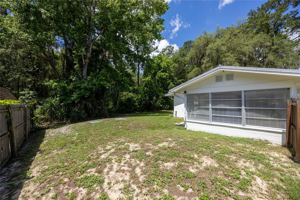 113 Browns Road San Mateo, FL 32187 - Photo 36 of 36 a front view of a house with a yard