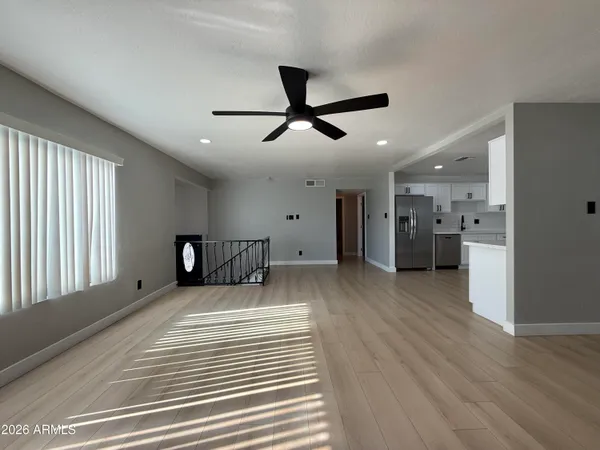a view of a livingroom with a kitchen