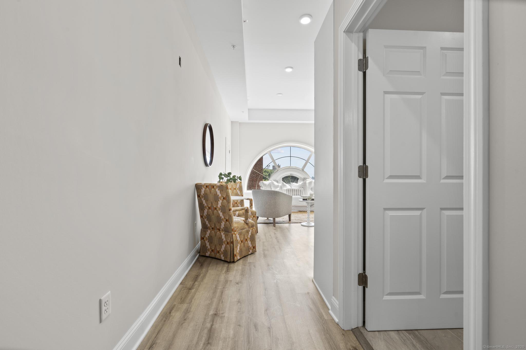 120 Broad Street, Unit 407 New London, CT 06320 - Photo 11 of 18 an entryway with a hardwood floor