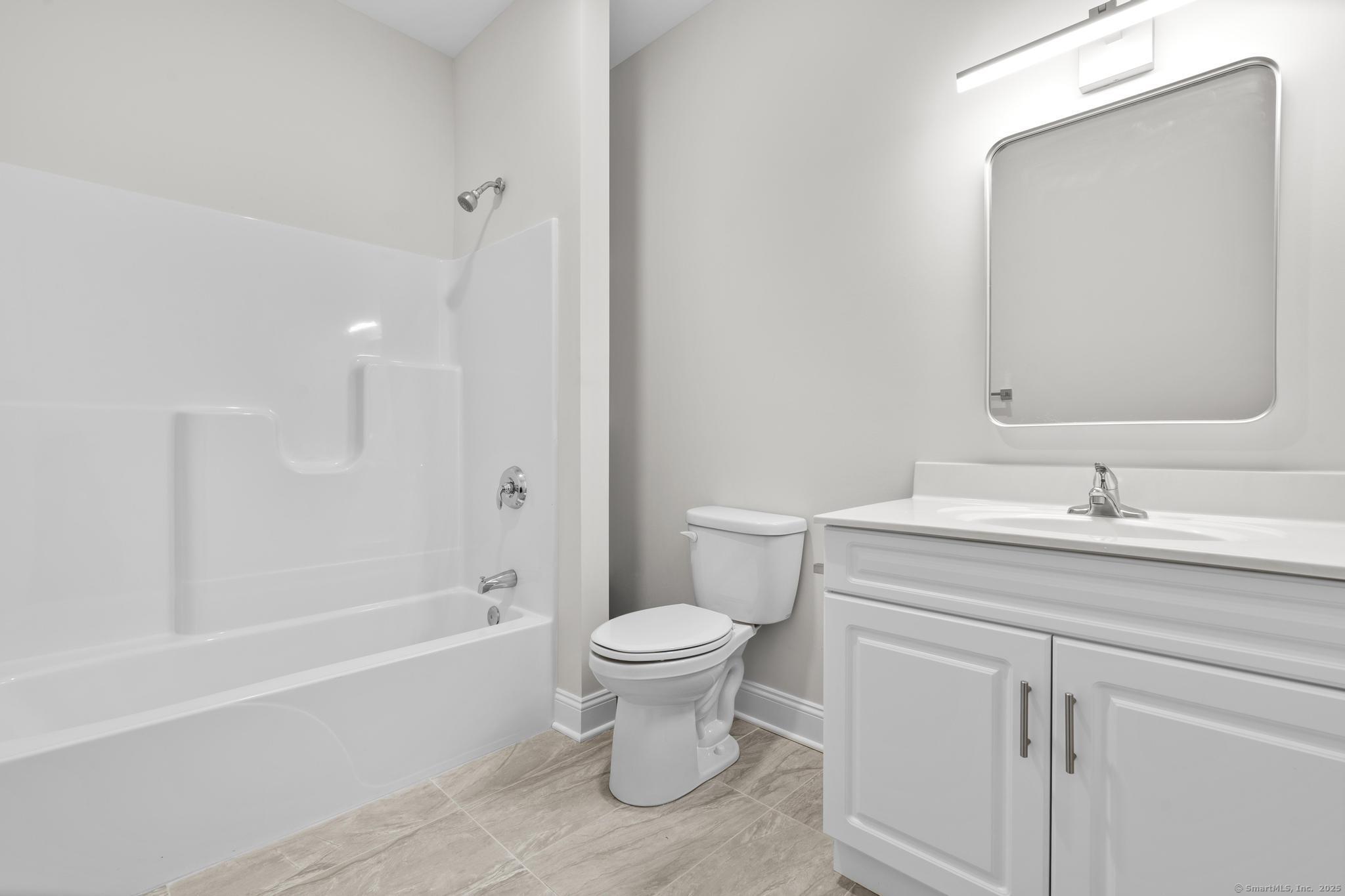 120 Broad Street, Unit 407 New London, CT 06320 - Photo 13 of 18 a bathroom with a sink toilet and shower