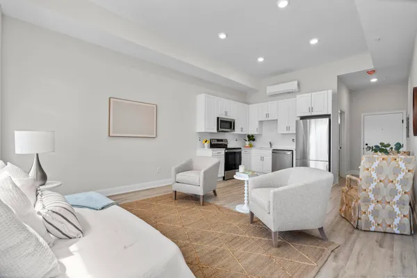 a bed room with furniture and a chandelier