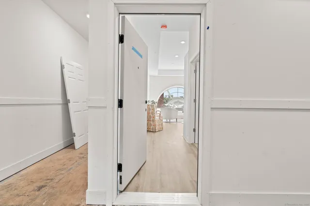 an entryway with a hardwood floor