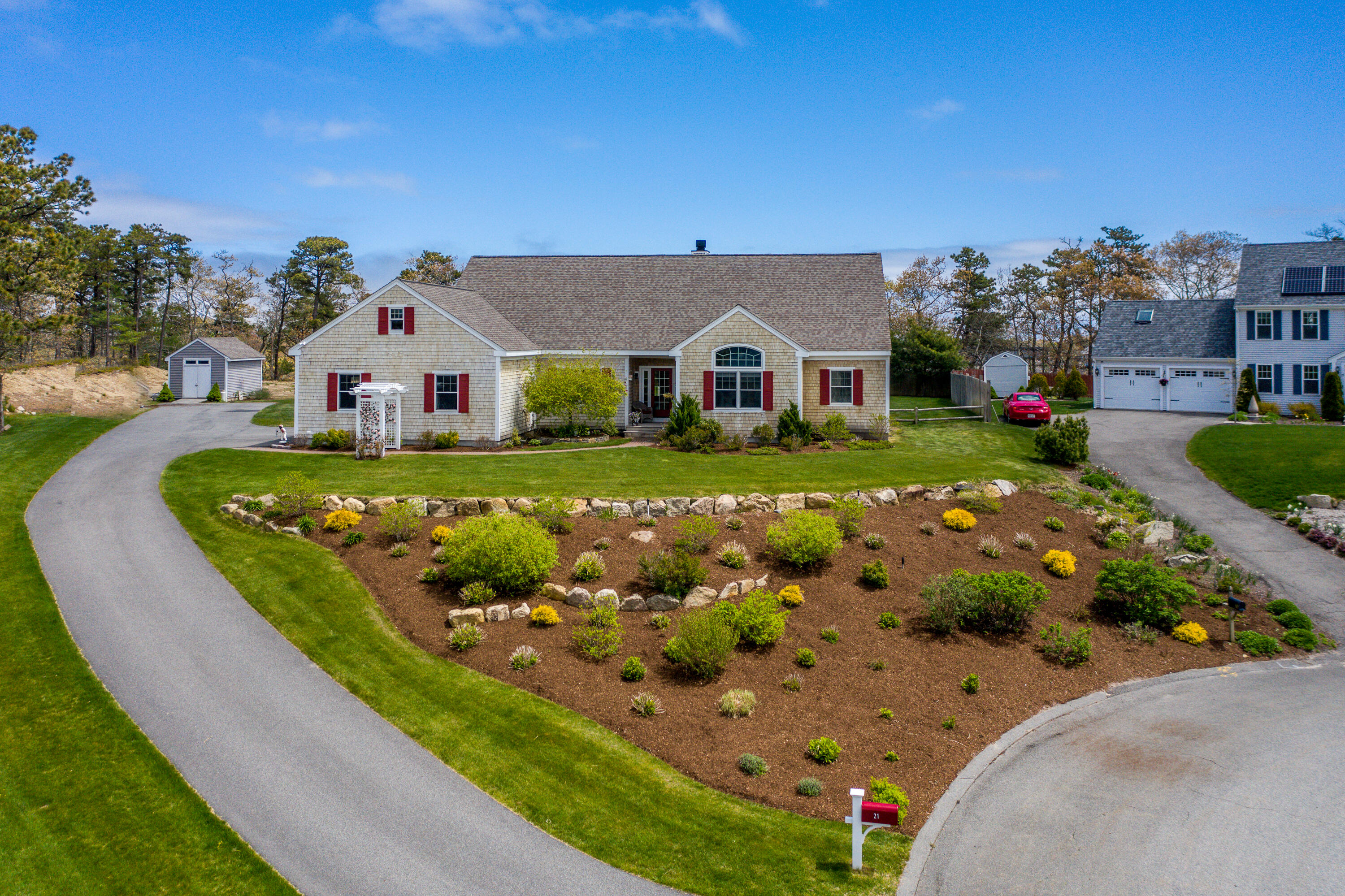 a front view of a house with garden