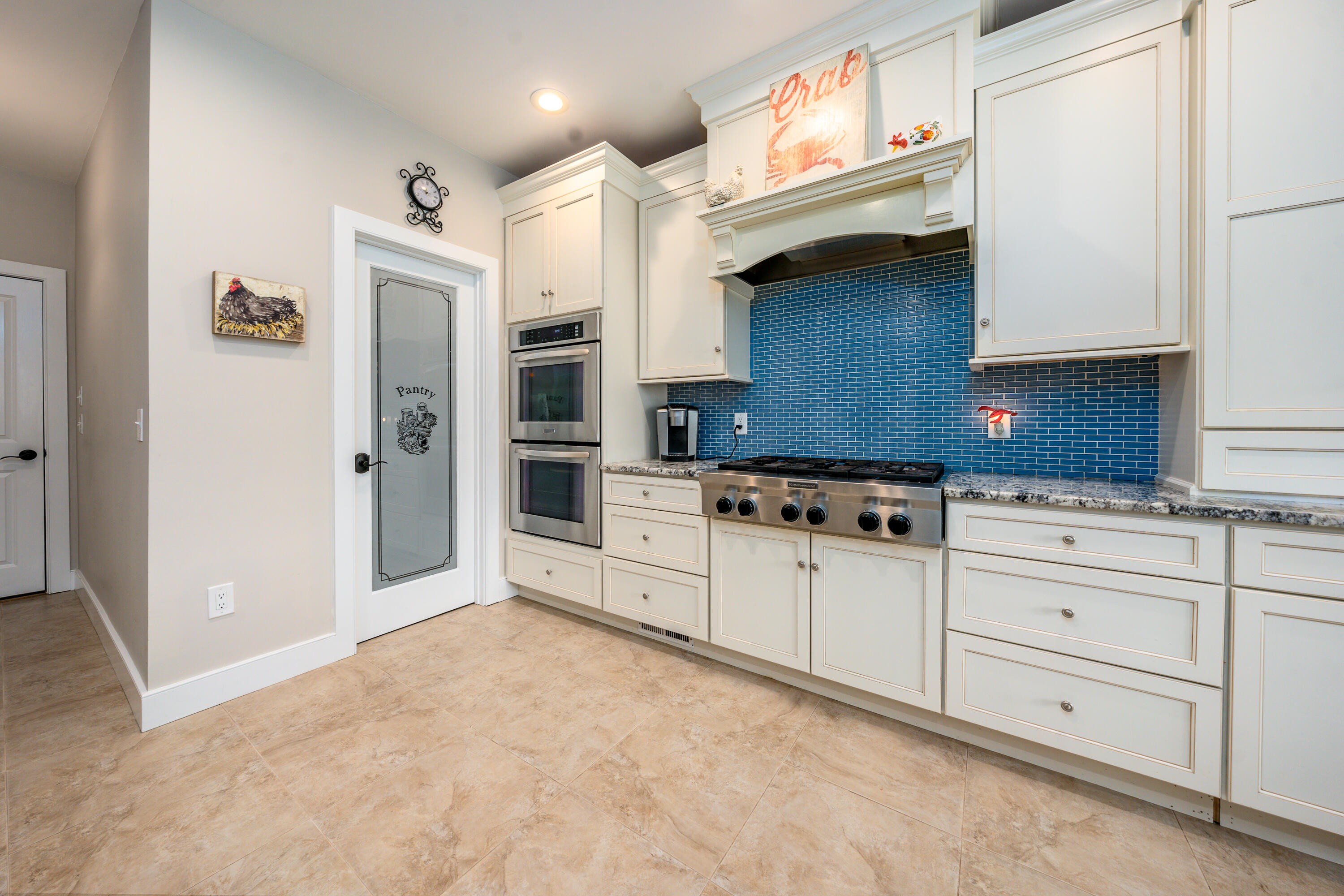 21 Jillian Drive Bourne, MA 02532 - Photo 11 of 46 a kitchen with granite countertop a stove a sink and a refrigerator