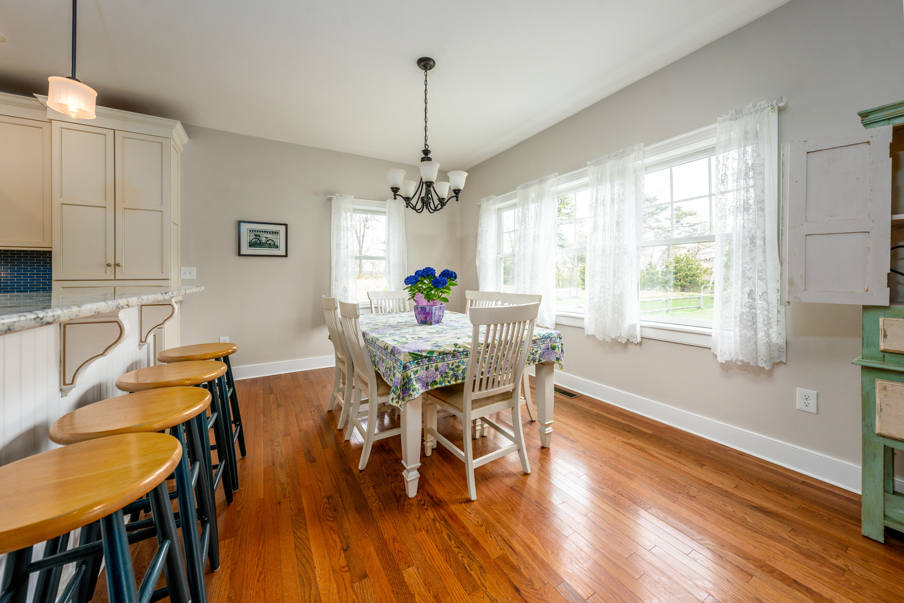 21 Jillian Drive Bourne, MA 02532 - Photo 14 of 46 a view of a dining room with furniture window and wooden floor