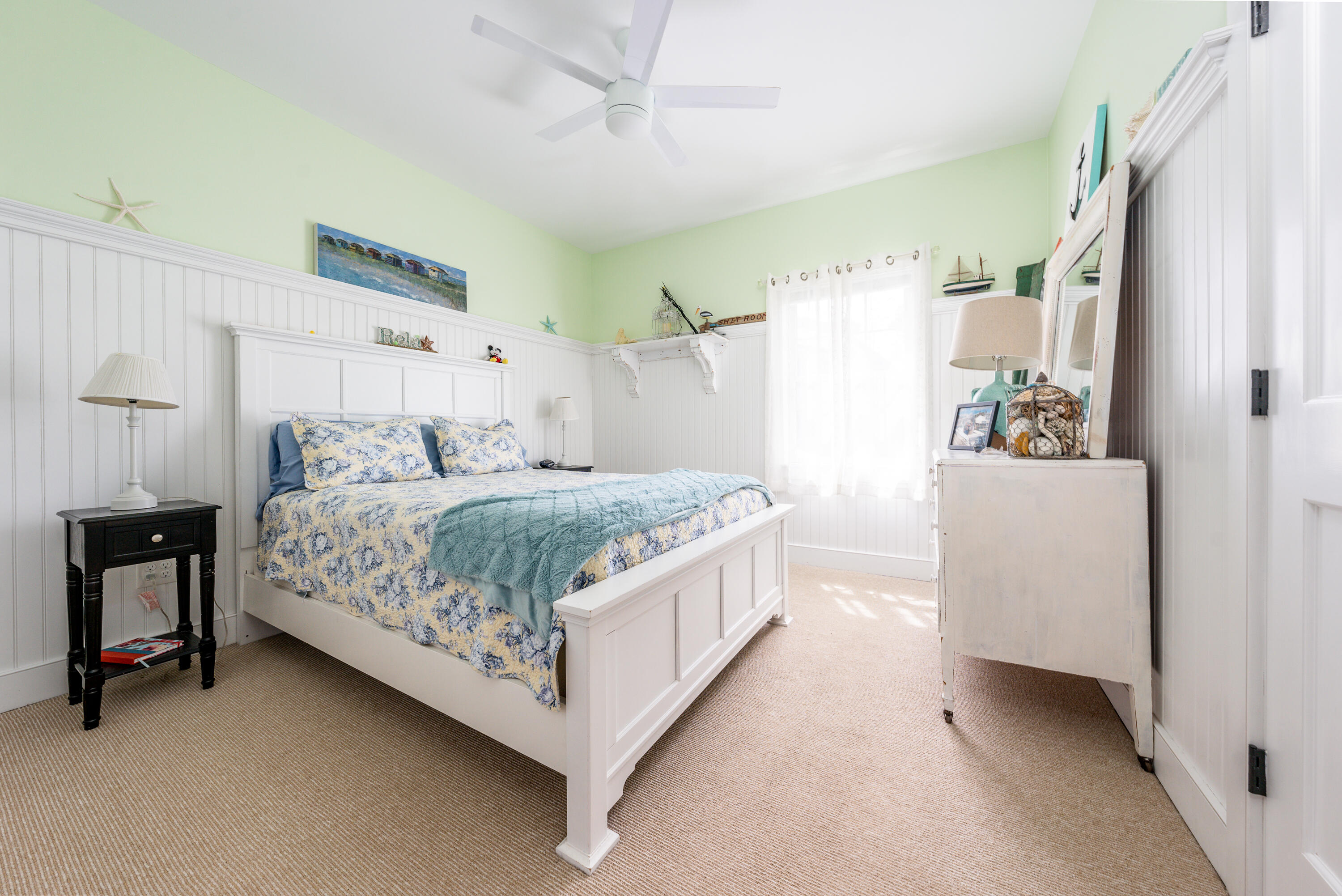 21 Jillian Drive Bourne, MA 02532 - Photo 24 of 46 a bedroom with a bed and a refrigerator