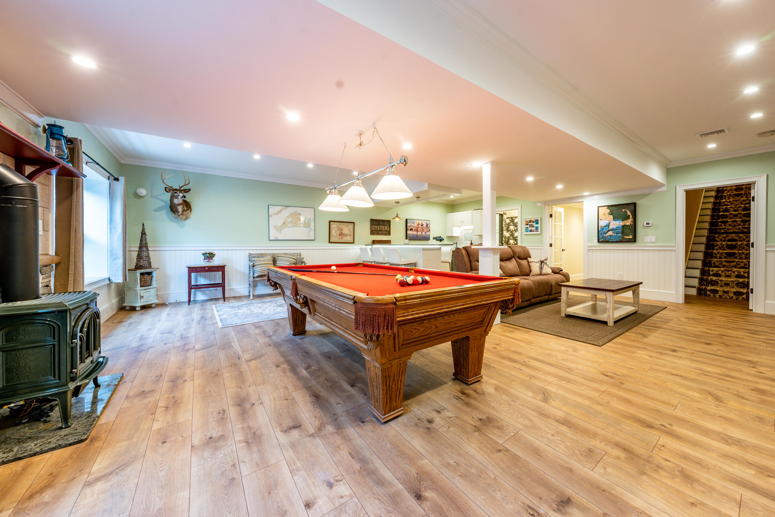 21 Jillian Drive Bourne, MA 02532 - Photo 29 of 46 a living room with furniture a pool table and a flat screen tv